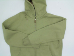 Light green jacket with a zippered hood Light green jacket with a zippered hood