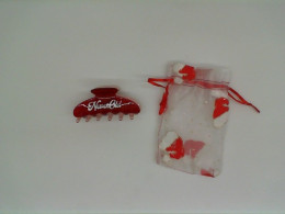 Red hair clip with souvenir bag