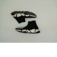 Black sneakers with white soles