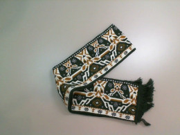 Warm green scarf with a pattern