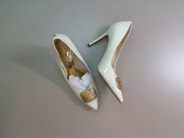 Women's high-heeled white shoes