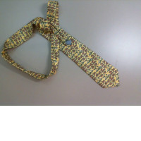 Yellow tie with a pattern of elephants