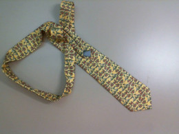 Yellow tie with a pattern of elephants