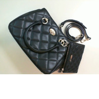 Women's black bag with a small wallet and leatherette