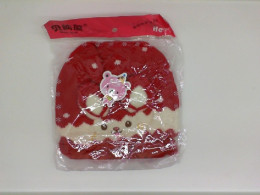 Children's red warm hat with a picture of a hare Children's red warm hat with a picture of a hare