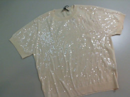 Women's beige jacket, decorated with beads Women's beige jacket, decorated with beads