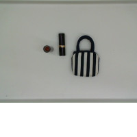 Set of 2 REVLON lipsticks included with bag