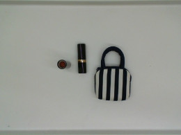 Set of 2 REVLON lipsticks included with bag Set of 2 REVLON lipsticks included with bag