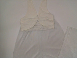 Suit: white vest and long wide pants