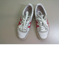 Women's white sneakers with red stripes