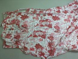 Sleeveless button down dress, white with red designs Sleeveless button down dress, white with red designs