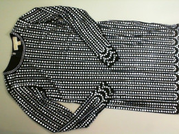Black short dress, decorated with sequins, long sleeve