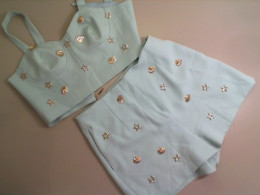 Set of women's turquoise top + shorts decorated with shells
