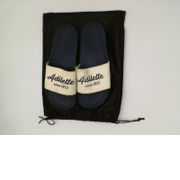 shoes blu&white in a black bag