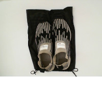 sneakers white&black in a black bag