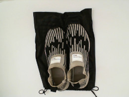 sneakers white&black in a black bag sneakers white&black in a black bag