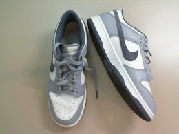 Gray and white Nike sneakers