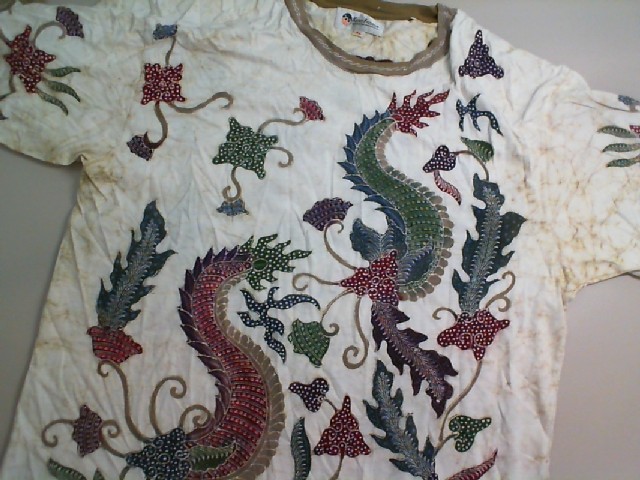 Beige T-shirt with colored pattern Beige T-shirt with colored pattern