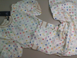 Dress, long, white with multi-colored patterns Dress, long, white with multi-colored patterns