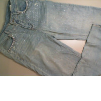 Flared jeans, decorated with sequins