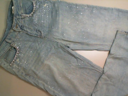 Flared jeans, decorated with sequins Flared jeans, decorated with sequins