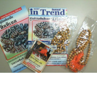 A set of 2 brochures in Thai, 2 sets of wooden beads, 1 instruction for making bracelets.