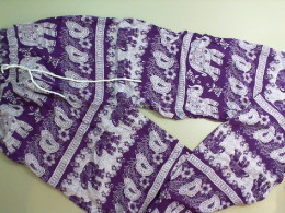 Light trousers, with elephant pattern