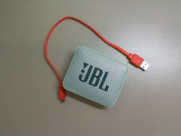 Small JBL speaker + charging cable