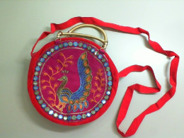 Velvet red bag with peacock embroidery