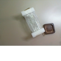 Glass square vase on a wooden stand