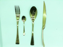 A large set of kitchen utensils consisting of a fork, a knife, a teaspoon and a tablespoon (for 15 people)