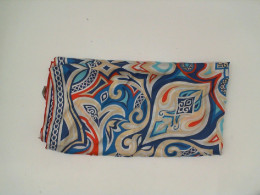 Light blue and cream colored scarf with pattern 