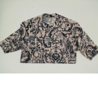 Women's cream-colored round-neck shirt with black pattern