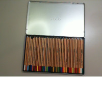 Set of colored pencils in a metal box