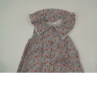 White children's dress with red floral pattern White children's dress with red floral pattern
