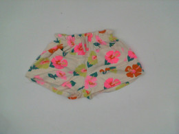 Cream colored children's pants with patterns