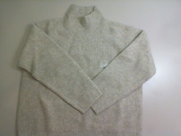 Women's knitted sweater with a high neck Women's knitted sweater with a high neck