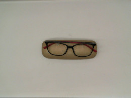 Eyeglasses in a gold box