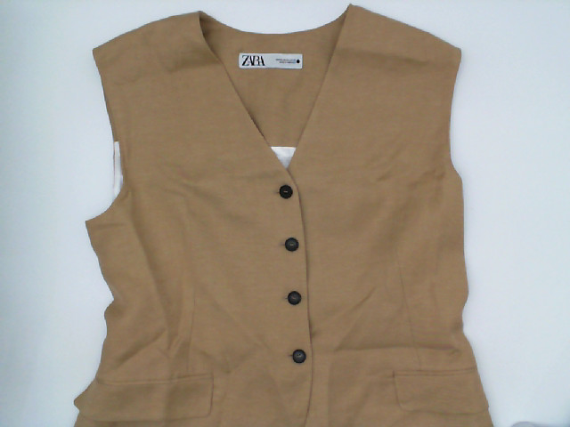 Cream sleeveless suit Cream sleeveless suit