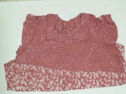 Pink wide neck shirt with white pattern