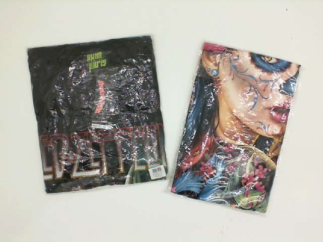 Set of 2 ROCK@TEES t-shirt with woman print.Size XL Set of 2 ROCK@TEES t-shirt with woman print.Size XL