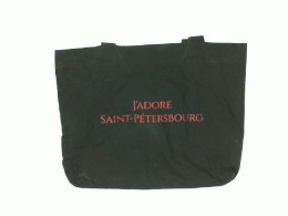 Black cloth bag with red letters