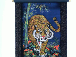 Black scroll image of a male tiger in the forest