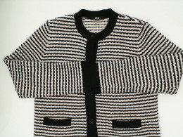 White long-sleeved coat with black pattern