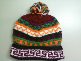 Warm hat with a lush bubo