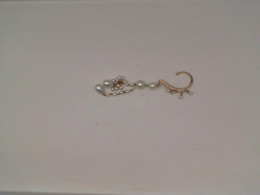 Gold earrings with pearl beads