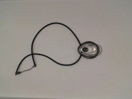 Black necklace with black and silver pendant