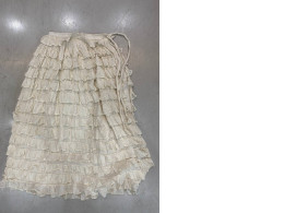 Long white skirt tied at the waist 