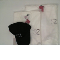 White shirt and black hoodie and hat 