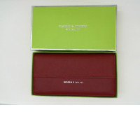 Red women's wallet in a green box 